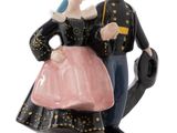 a figurine of a man and a woman dressed in military clothing