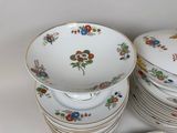 a lot of plates and bowls that are stacked together