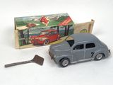 a toy car and a hammer in front of a box