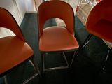 three chairs that are sitting in a room together