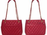 a pair of red quilted handbags on a white background