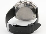 a close up of a watch on a white surface