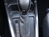 a close up of a car ' s gear lever in the center console