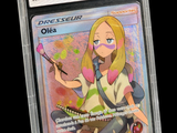 une image représentant une carte à collectionner Pokémon sur laquelle figure une jeune fille tenant un pinceau