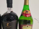 three bottles of wine sitting next to each other on a table