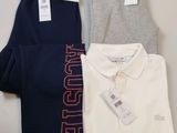 three men ' s polo shirts and pants are on a table