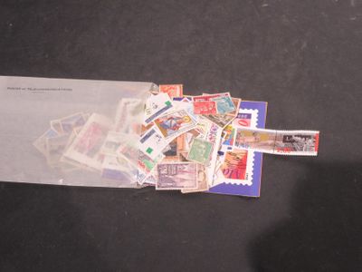 a pile of stamps on a piece of paper on a table