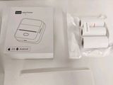 a white box with a picture of a cell phone and a charger
