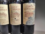 three bottles of wine sitting on top of a counter next to each other
