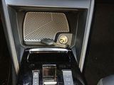 a picture of a car dashboard with a clock and radio