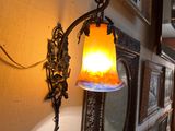 a light that is on on the wall in the hallway