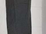 black pants hanging on a white wall in a room