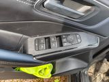 a close up of a car ' s interior with a remote control