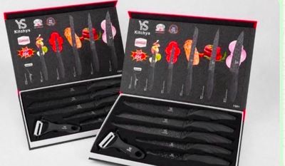 two sets of knives in a black box with red handles