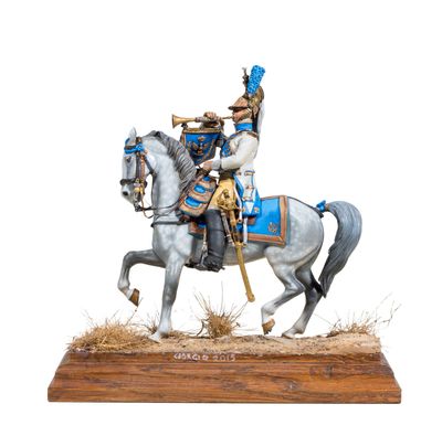 figurine of a man on a horse with a trumpet in his hand