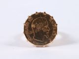 an image of a gold ring with a coin in the middle of it
