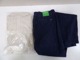 two pairs of pants sitting on a table next to each other