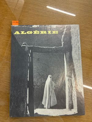 the cover of a magazine with a picture of a woman in a white robe