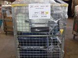 a cart with a lot of luggage in it in a warehouse