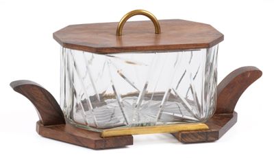 a glass container with a wooden handle on a stand