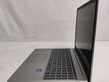 an open laptop computer sitting on top of a white surface