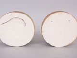 pair of white and gold ceramic vases with curved handles