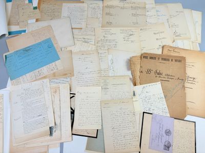 a pile of old letters and papers on a table