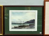 three framed pictures on a shelf next to each other