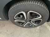 a close up of a tire on a car ' s rim