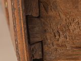 a close up of a wooden drawer with a drawer underneath it