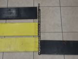two black and yellow boards on a tiled floor