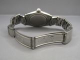 an image of a close up of a wrist watch on a table