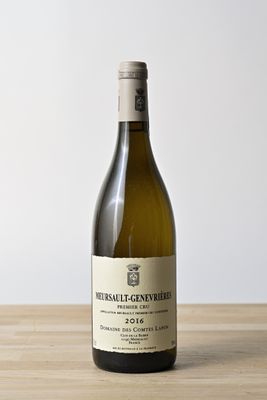 a bottle of wine that is sitting on a table