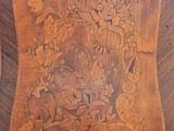 a wooden clock that has a floral design on it