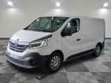 the white van is parked on a checkered floor in a room
