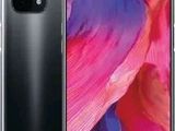 a close up view of the back of a black and pink phone