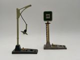two small scale model of a street light and a bird
