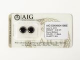 two pairs of black diamonds on a card with a price tag