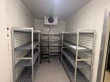 a long room with a lot of shelves in it