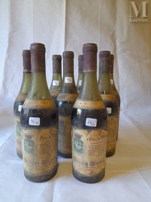 several bottles of wine are lined up on a table