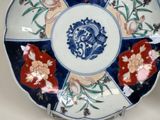 a decorative plate with a blue and white design on it