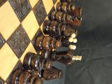 a chess board with a lot of chess pieces on it