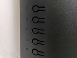 a close up of a black computer on a white surface