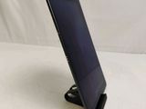 a tablet that is sitting on a stand on the table