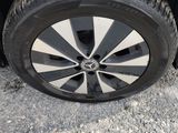 a car that has a tire on the side of the road