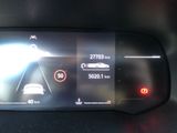 the dashboard of a car with a digital display on it