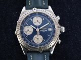 a watch with a blue dial on a blue strap