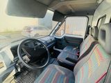 a picture of a car with a steering wheel and seat covers