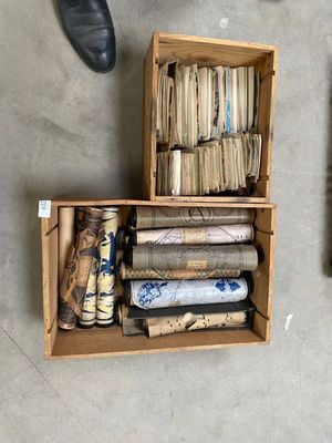 a wooden box filled with books and a pair of shoes