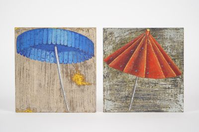 two paintings of umbrellas painted on the wall
